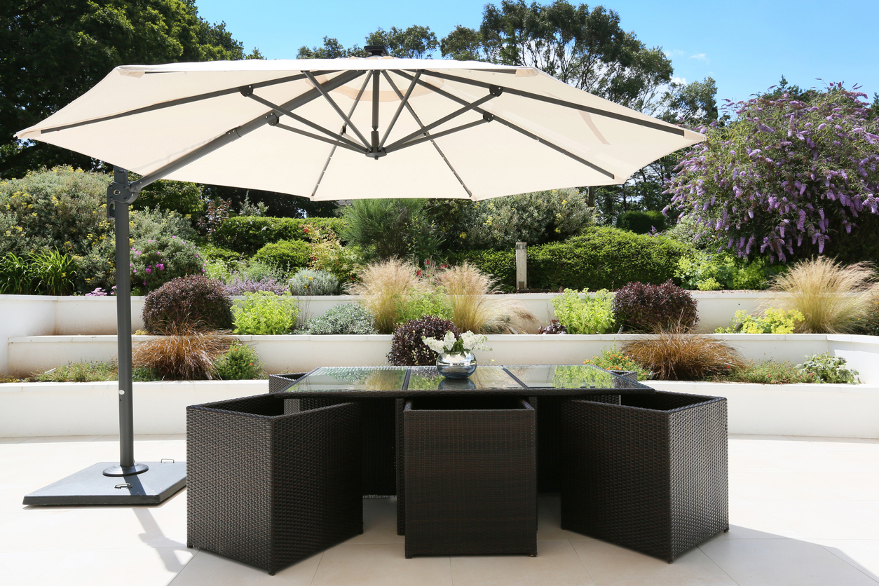 patio umbrella over outdoor dining set
